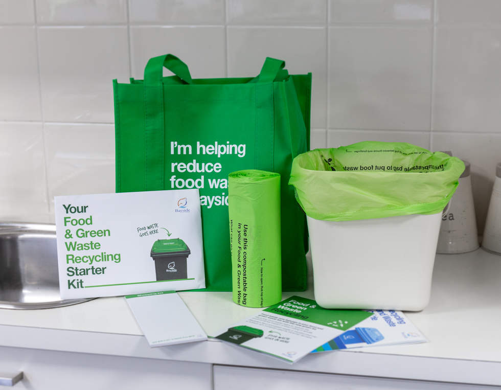 Food and green waste start pack, including a bin caddy, compostable bags and a shopping bag.