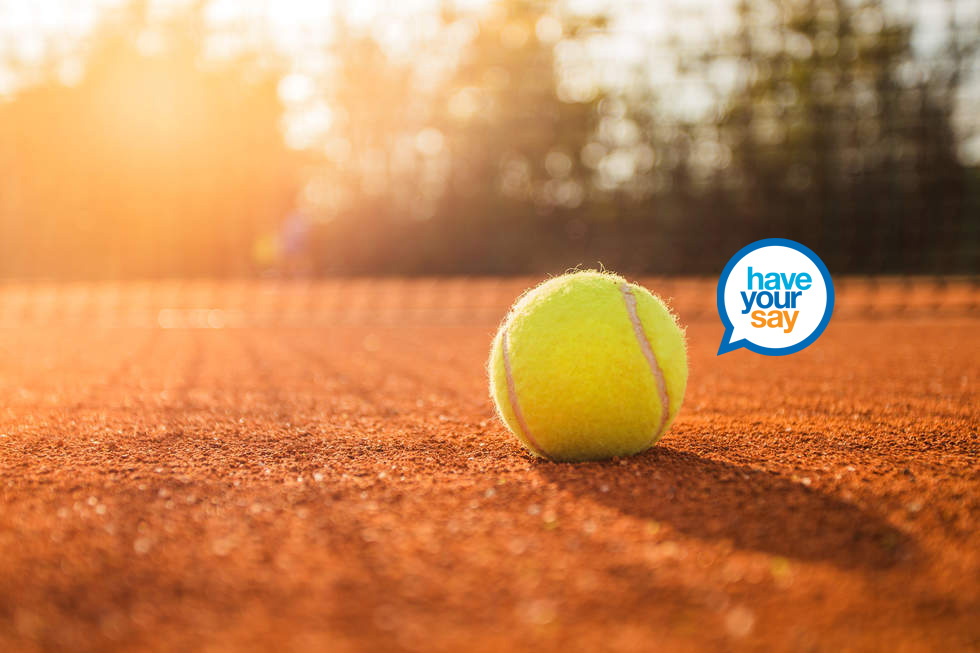 Tennis ball on a red court with the Have Your Say logo 