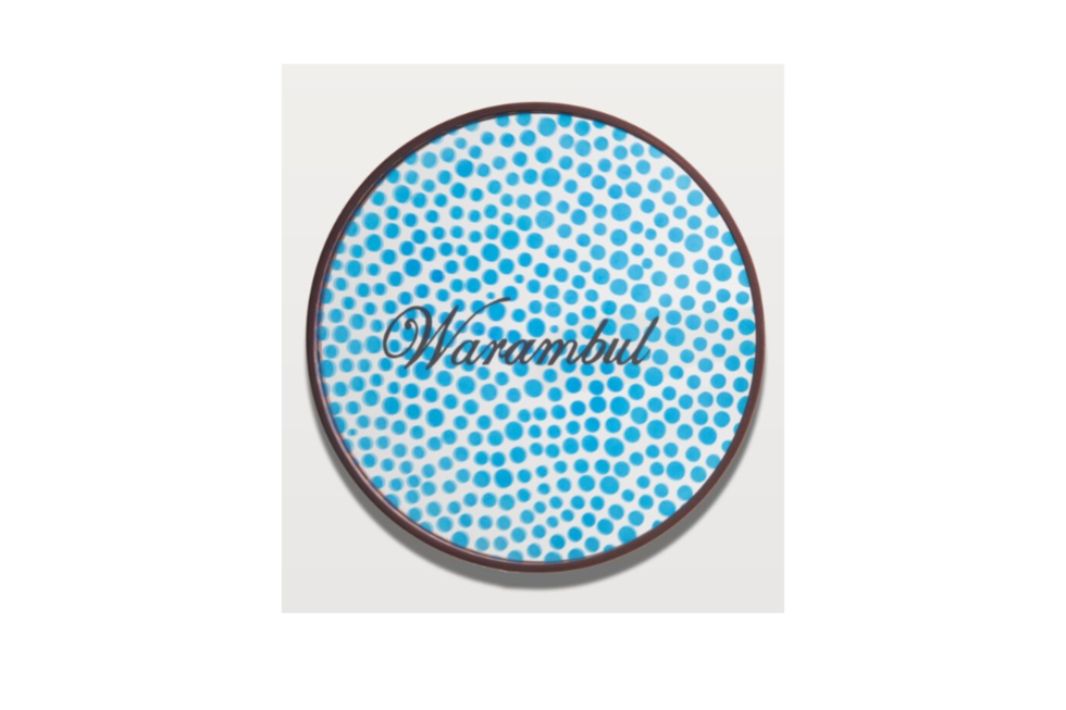 Blue and white dot design on a white wall