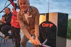 Bayside mayor Cr Alex del Porto turning on the Christmas light with a giant 'on-off' lever.