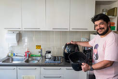 A person using an airfryer