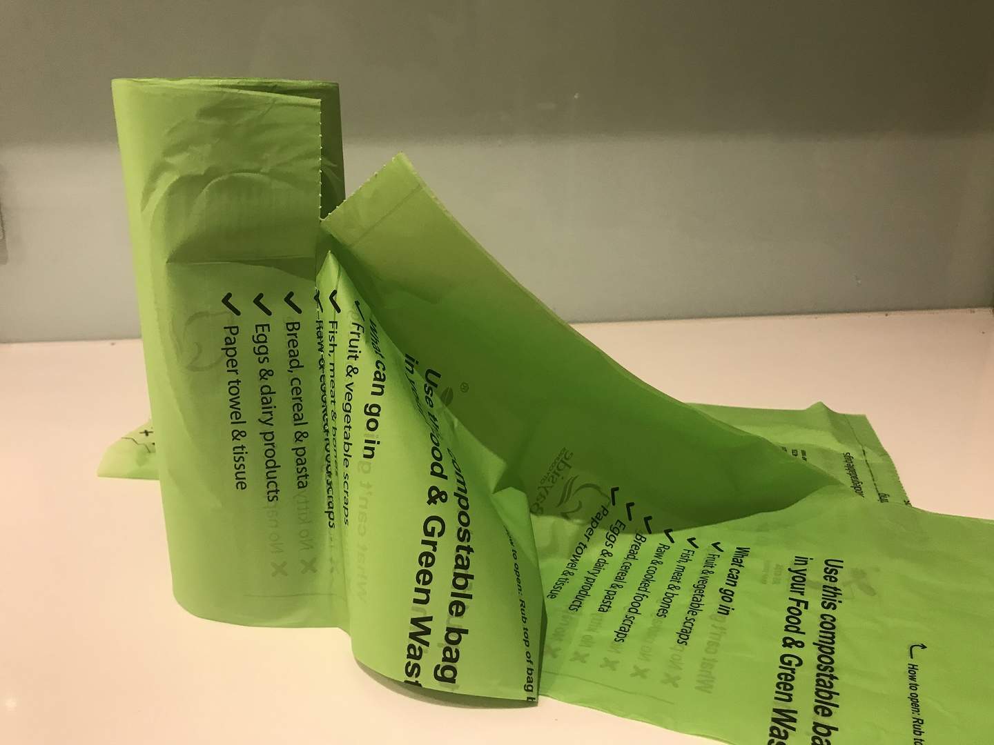 Roll of compostable bags labelled with the AS4736 (Australian Standard) logo