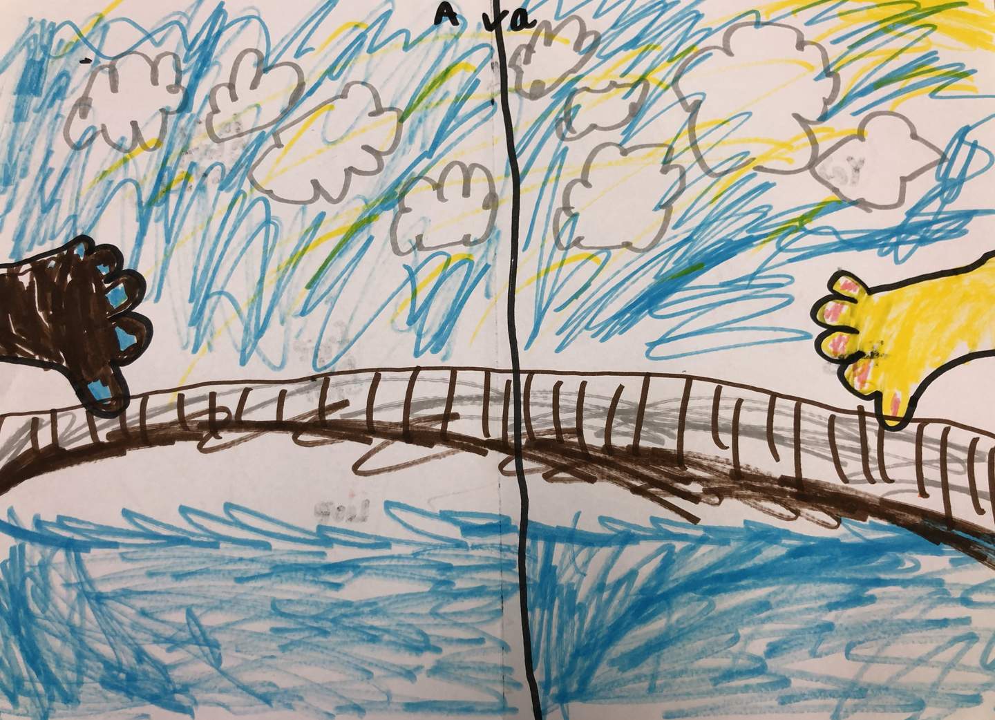 Childs drawing of two hands about hold over a bridge with clouds.