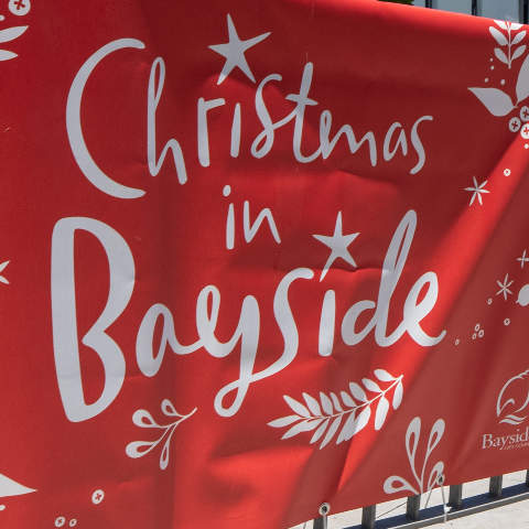 Christmas in Bayside banners line a street.