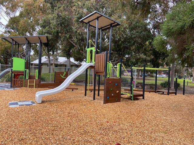 Playground with bumpy slide and rock climbing wall 