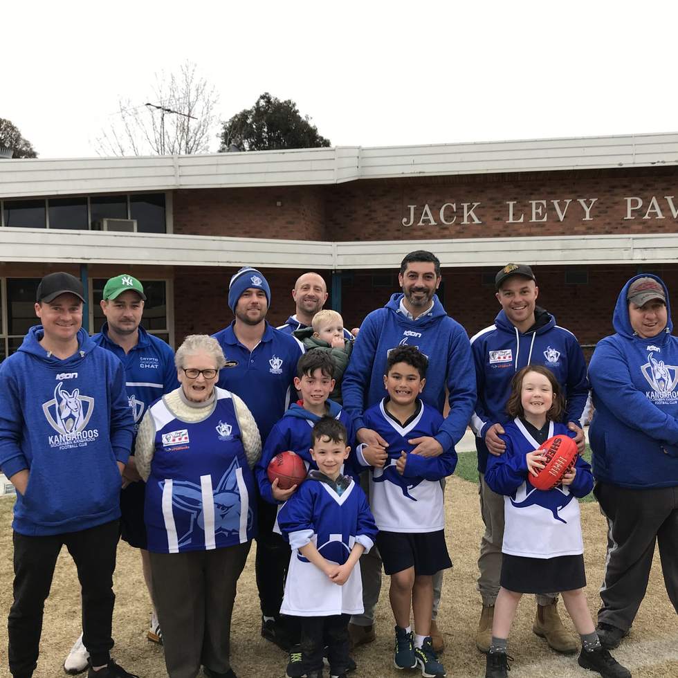 Moorabbin Kangaroos Football Club members in front of Jack Levy Pavilion