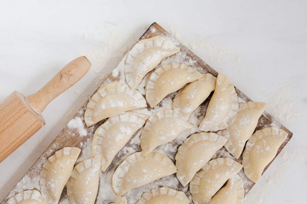 Dumplings on a chopping board. 