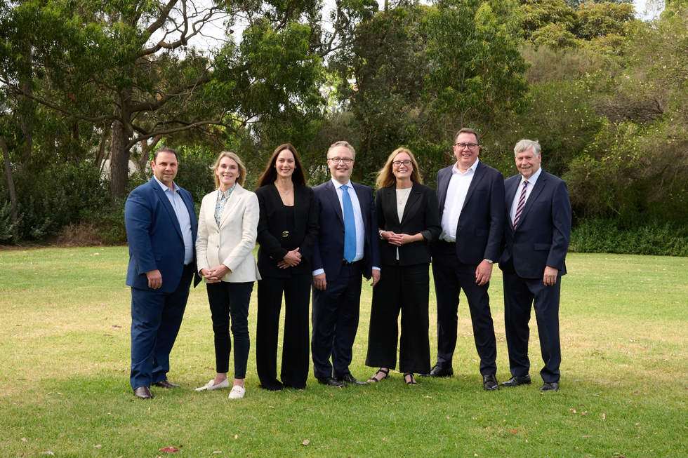 A group of people who were elected as Bayside's new Councillors in the 2024 election standing outside against a background of green leafy trees